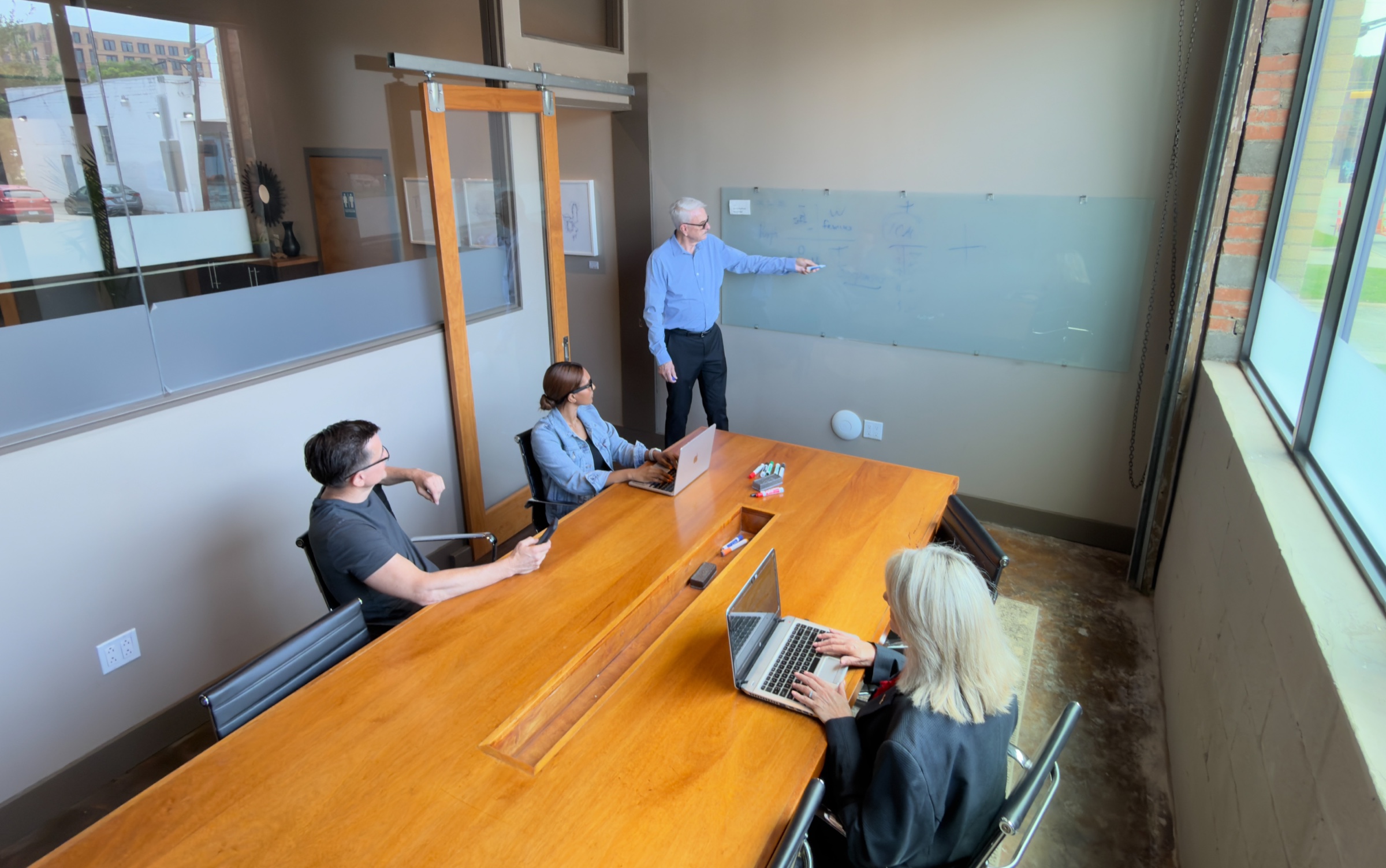 A team meeting in the GeniusDen conference room